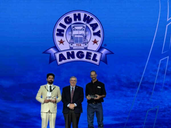 Daljit Sohi, Jason Corino on stage, goup photo