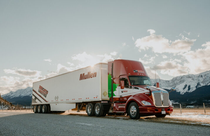 Mullen's CNG Truck with a trailer parked on the road