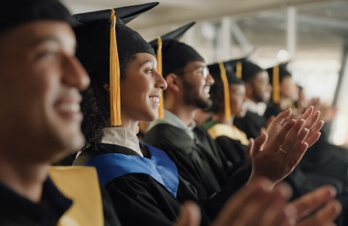 Student, university and graduation clapping or ceremony celebration of education achievement, scholarship or college. Men, woman and diversity applause or academy support or study, victory or event