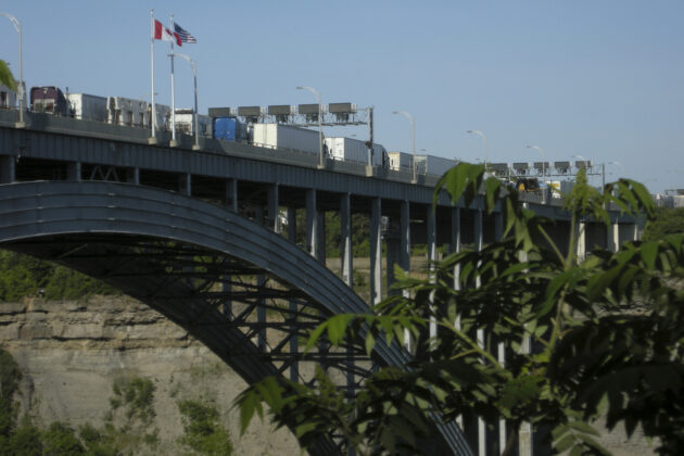 An endless line of trucks transporting goods over the Canada-US border