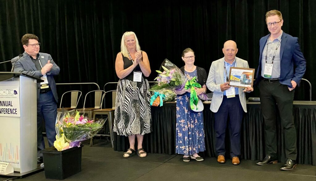 People on stage with PMTC's 2025 dispatcher of the year