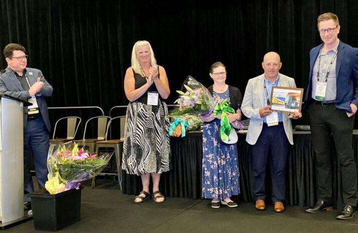 People on stage with PMTC's 2025 dispatcher of the year