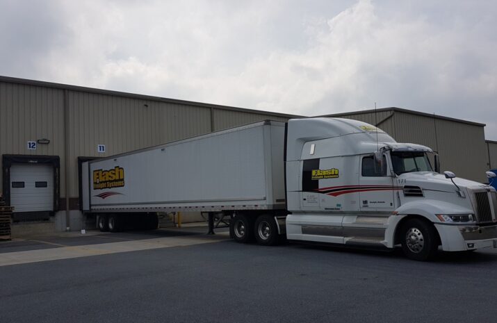 Flash Freight Systems' truck with the company's logo on it