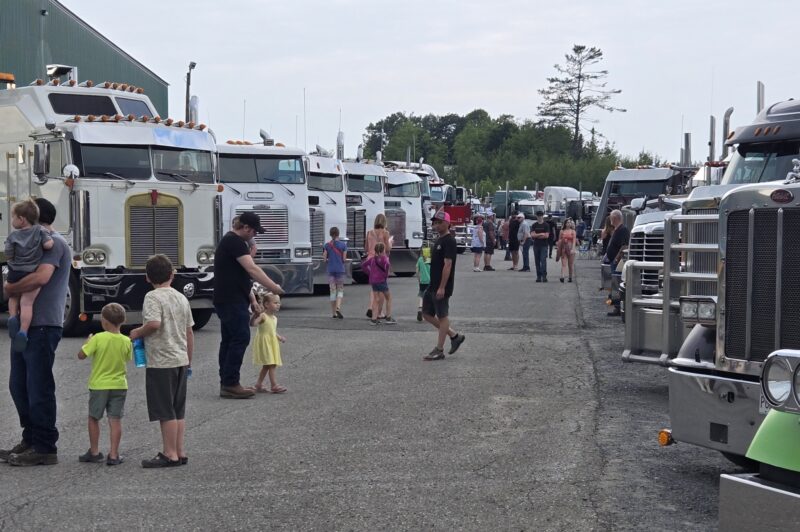 Families stroll past trucks at Big Iron Show N Shine