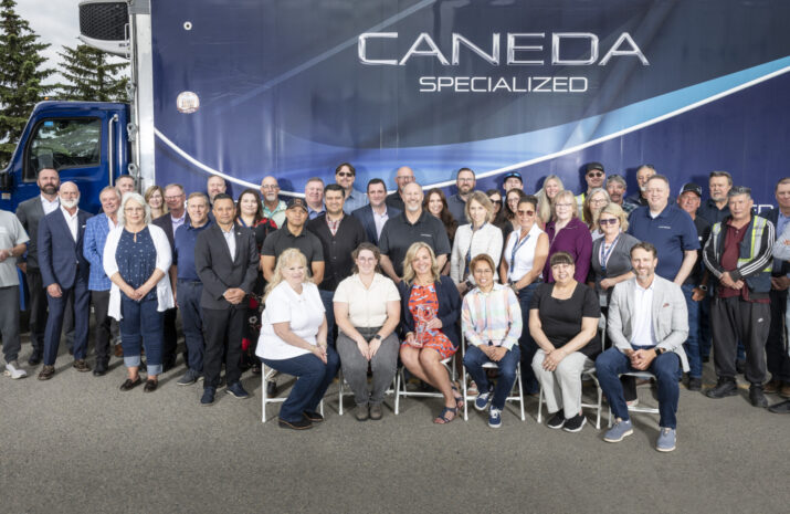 Group photo from the event, in front of Caneda-branded truck