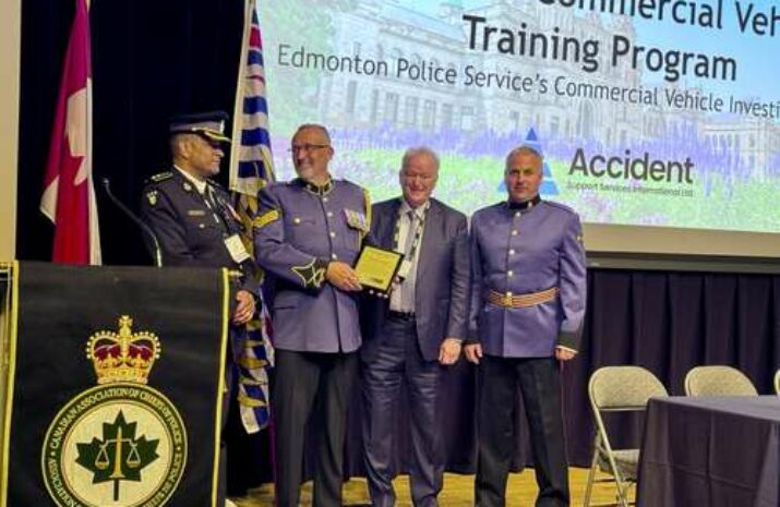 Edmonton police on stage accepting the award