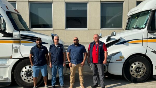 Mo Baki and his three highway drivers, group shot, left to right: Tajinder Pal Singh, Highway Driver Piotr Tobiasz, Highway Driver Mo Baki, Director of Operations Volodymyr Barulin, Highway Driver