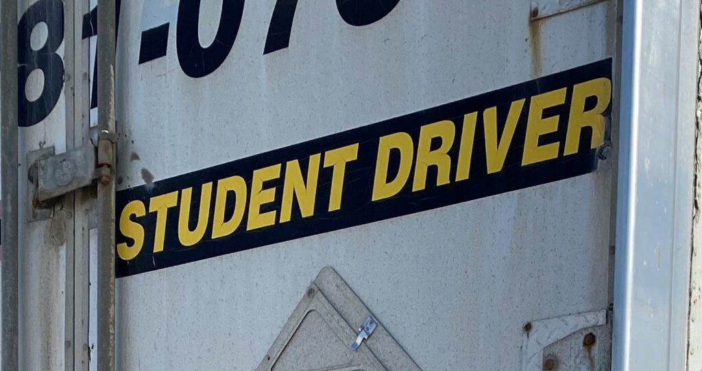 Picture of a trailer with Student Driver painted on it