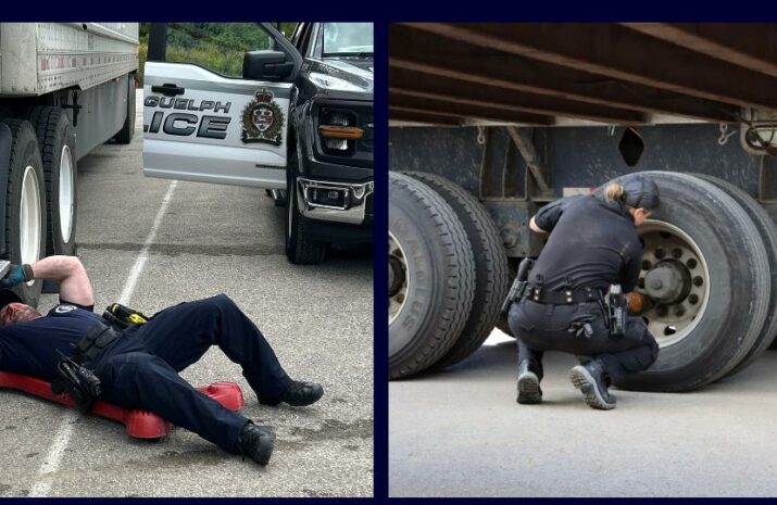 Picture of officers inspecting trucks