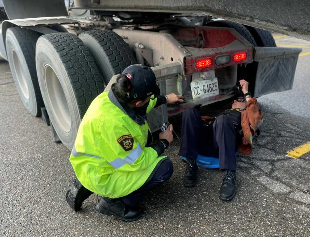 MTO officers inspecting a truck