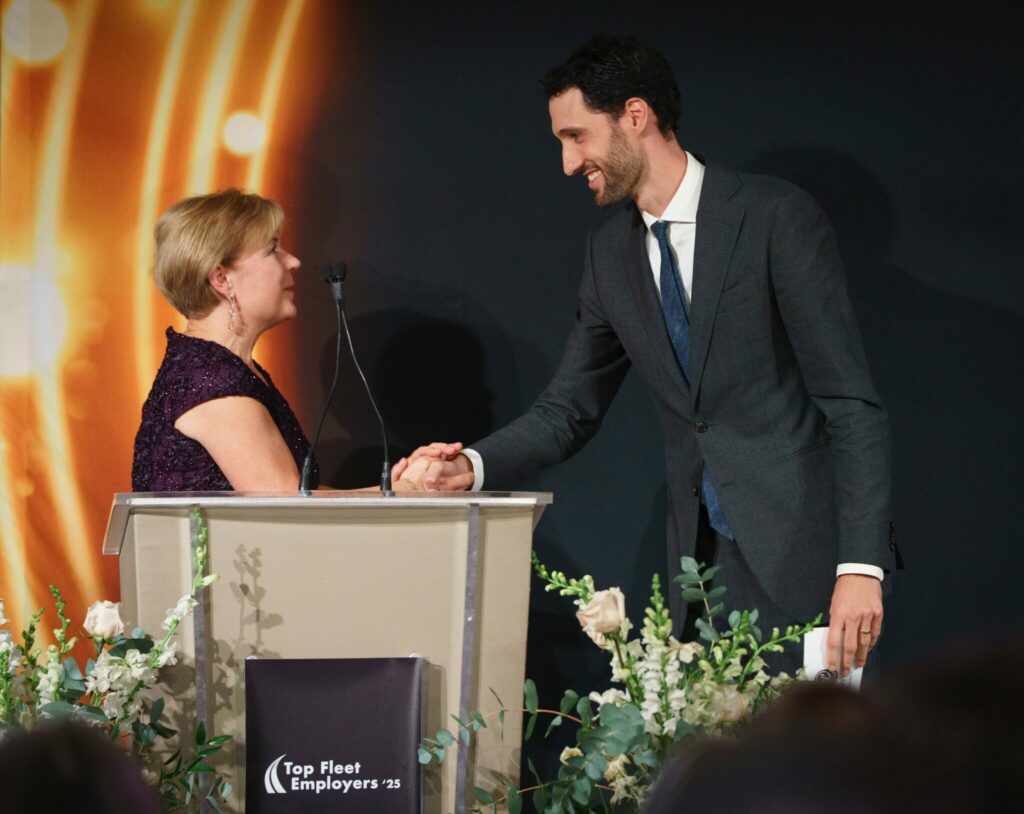 Picture of people shaking hands on a stage