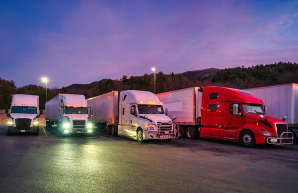 Trucks park at a truck stop.