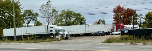 Trucks parked in a yard