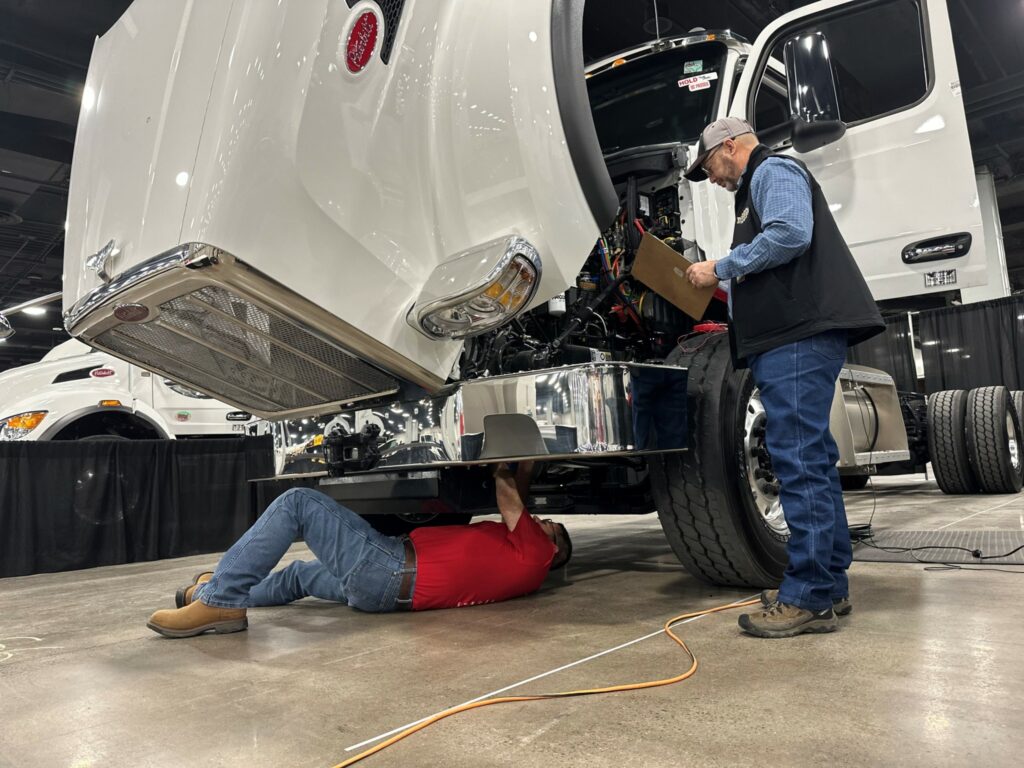 Technician works under a truck