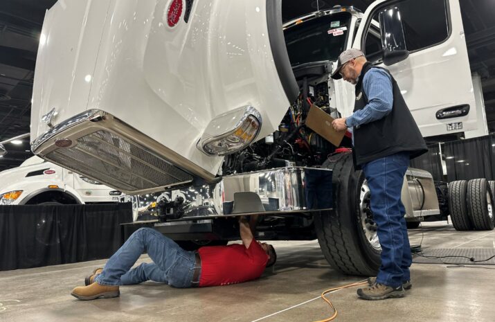 Technician works under a truck