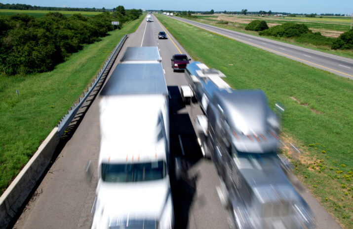 Motion-blurred 18-wheelers zipping down Interstate 40 in east Arkansas.