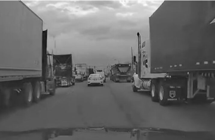 A road congested with trucks