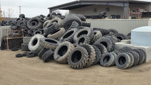 Large pile of used tires on the ground