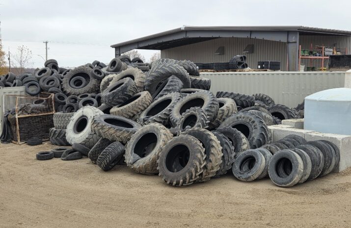 Large pile of used tires on the ground