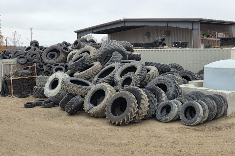 Large pile of used tires on the ground