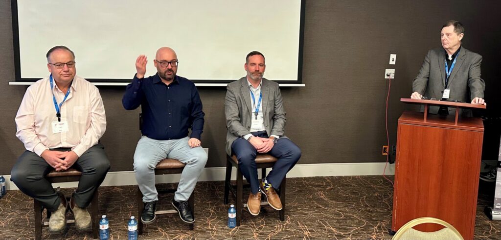 Picture of four men during a panel discussion
