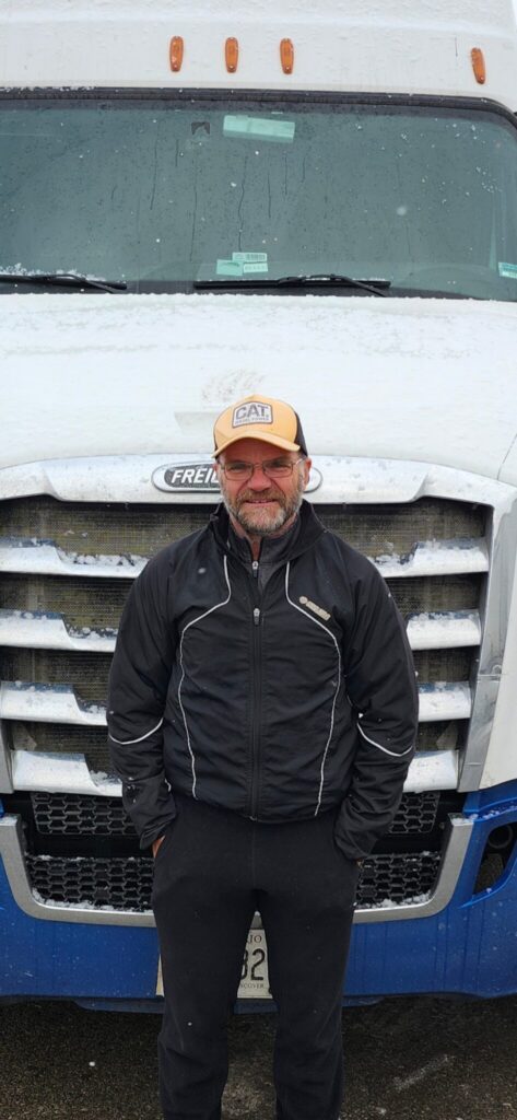 Picture of Shawn Cranwell in front of a truck