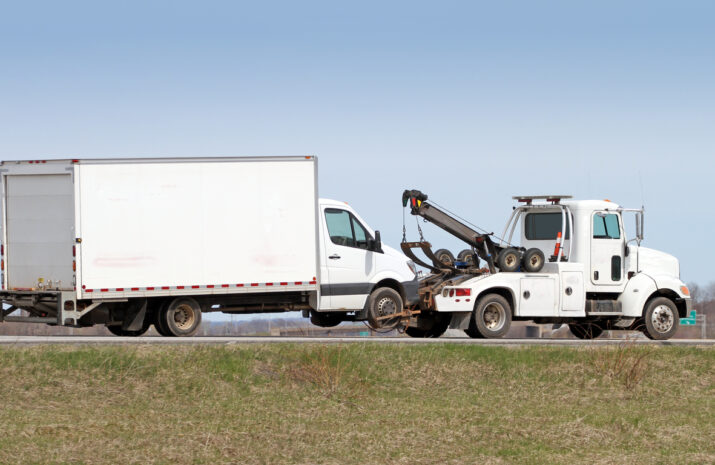 Tow Truck Towing A Truck On Highway in Canada