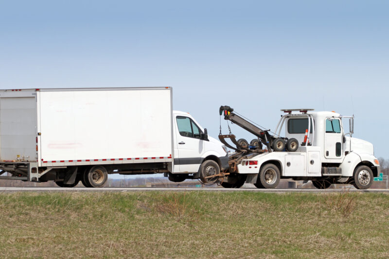 Tow Truck Towing A Truck On Highway in Canada