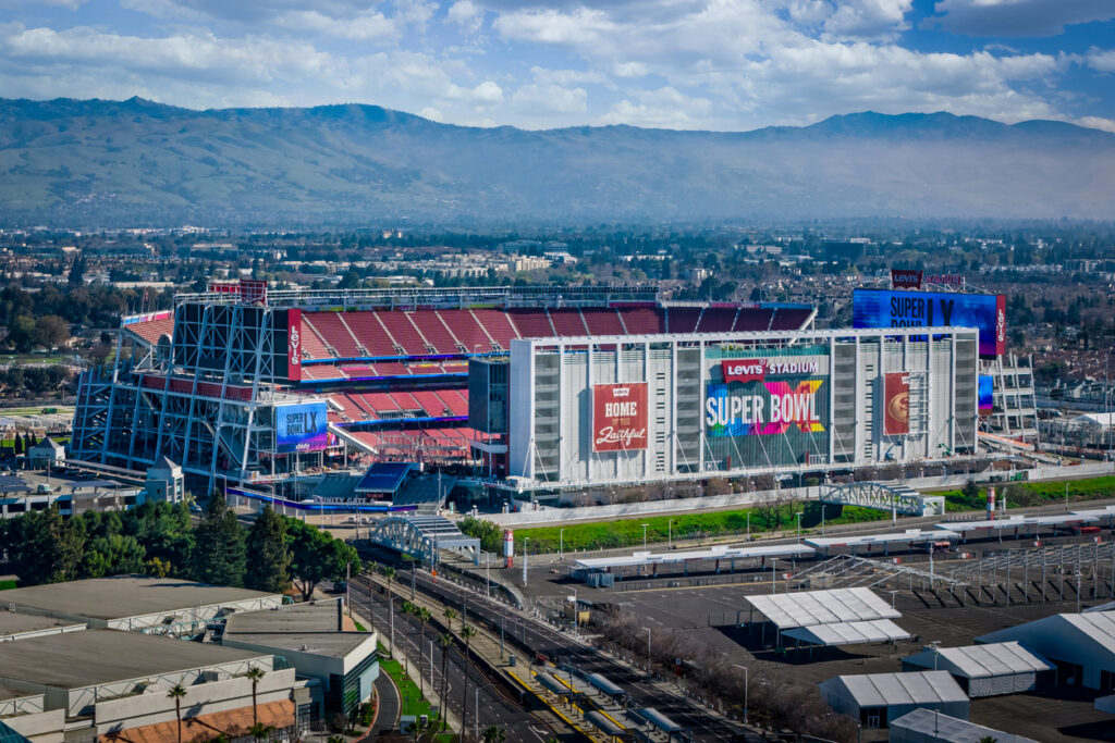 An aerial view of Levi's Stadium dressed for Super Bowl LX   2026 with a view of Santa Clara behind it.