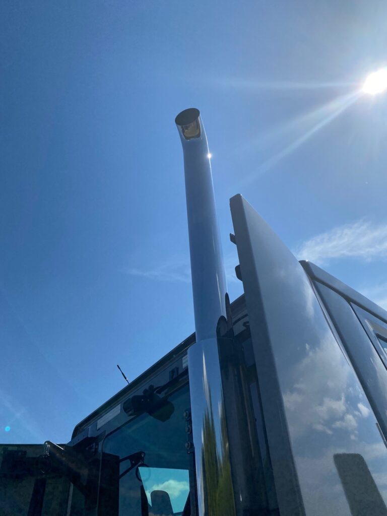 smokestack against blue sky