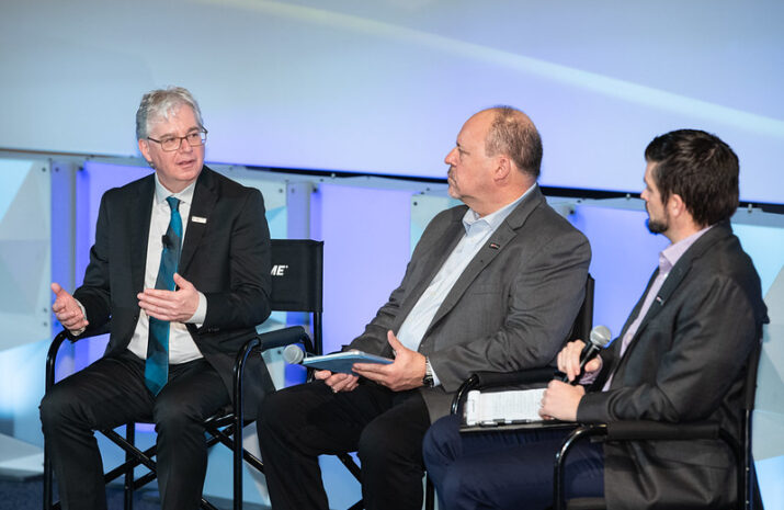 three speakers on the stage