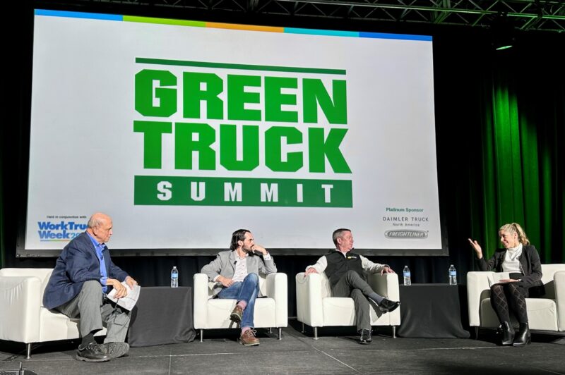 People sitting on couches on a stage