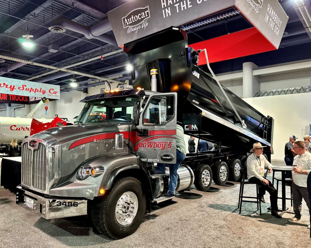 Picture of a truck and a guy with a cowboy hat