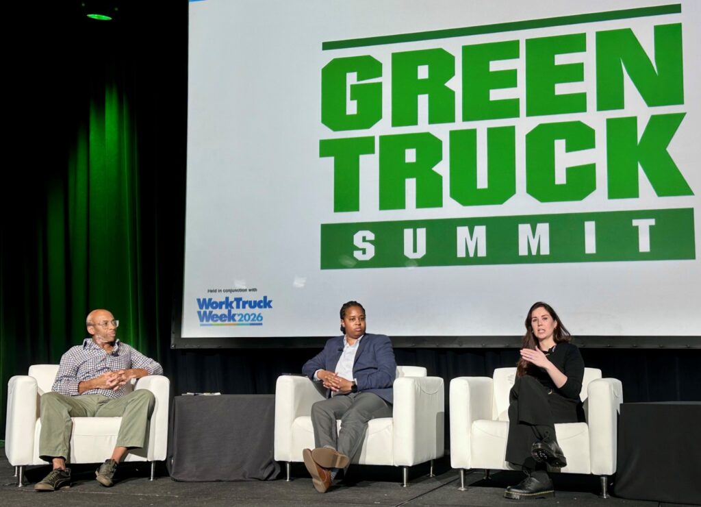 Three people on a stage