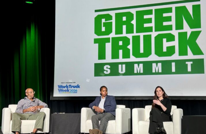 Three people on a stage