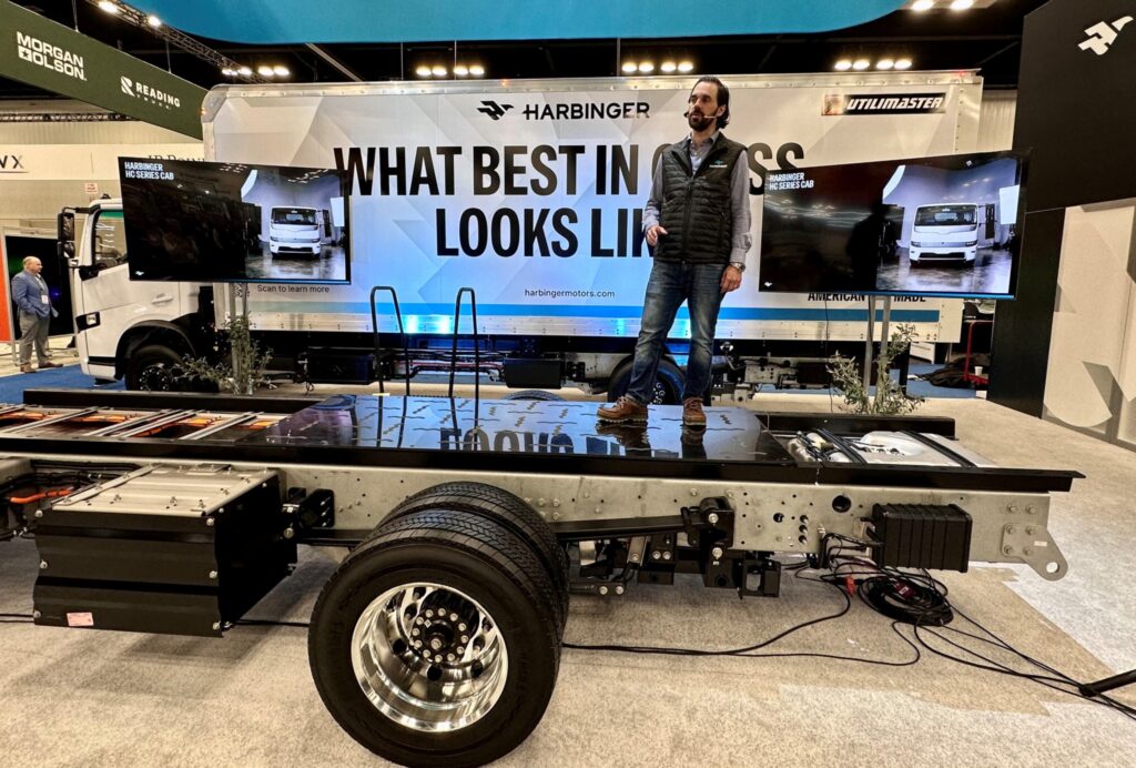 Man standing on a truck chassis