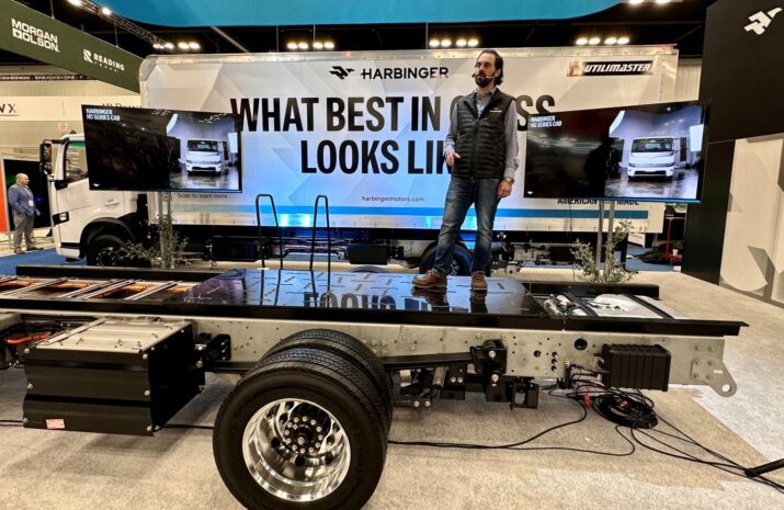 Man standing on a truck chassis