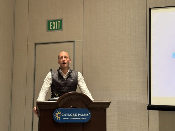 Hans Galland speaking to the press at the TCA annual conference in Orlando, Fla.