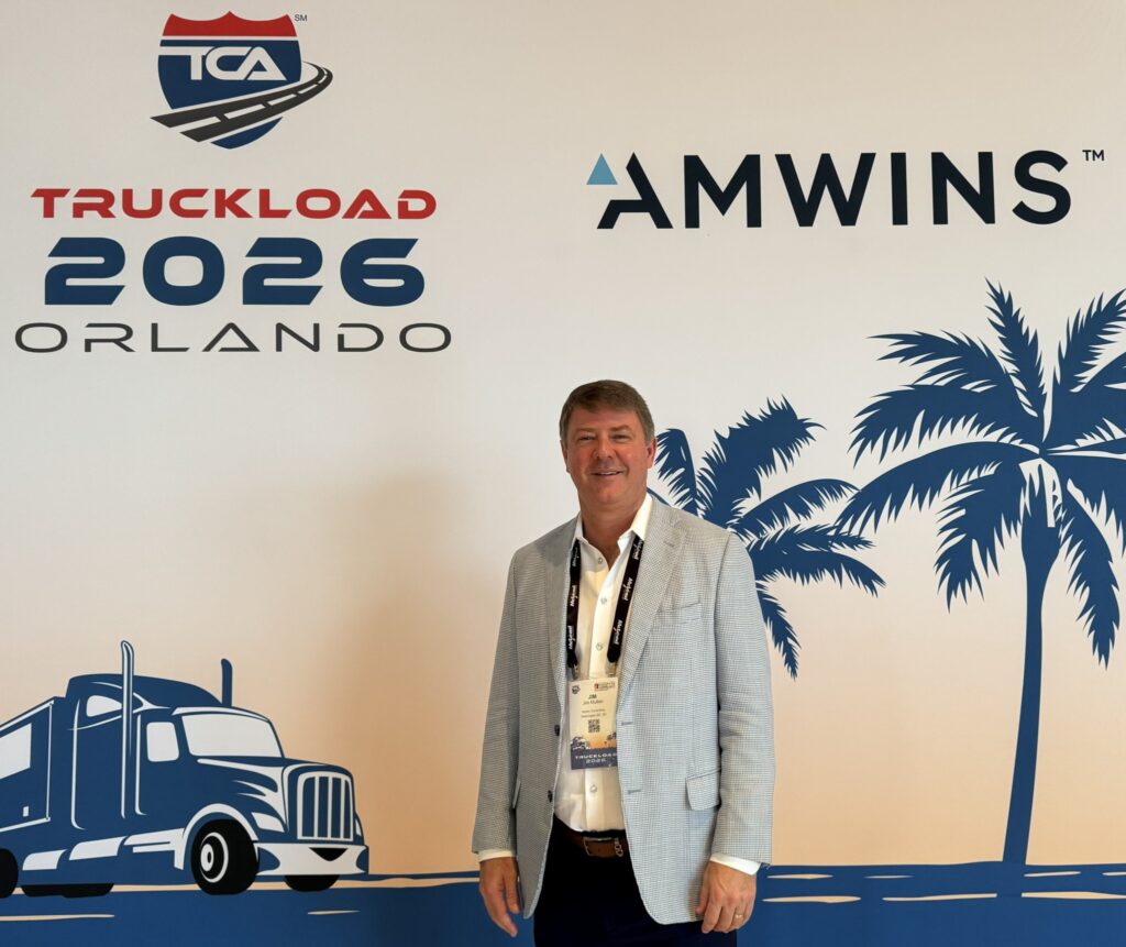 Jim Mullen in front of TCA banner, headshot