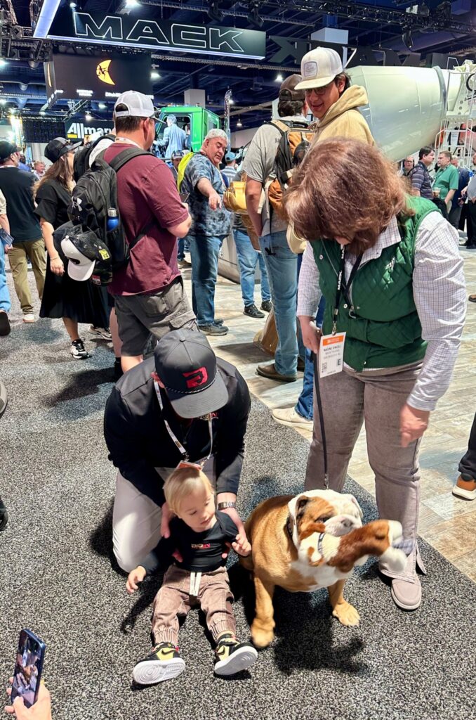 Attendees interact with a bulldog