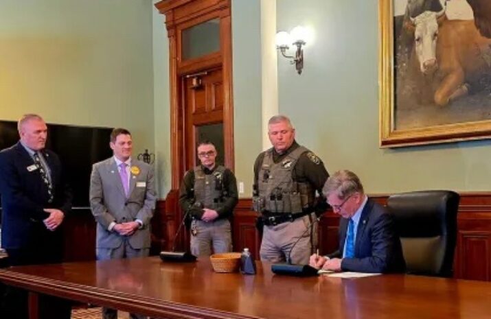 Wyoming Gov. Mark Gordon signs the law.