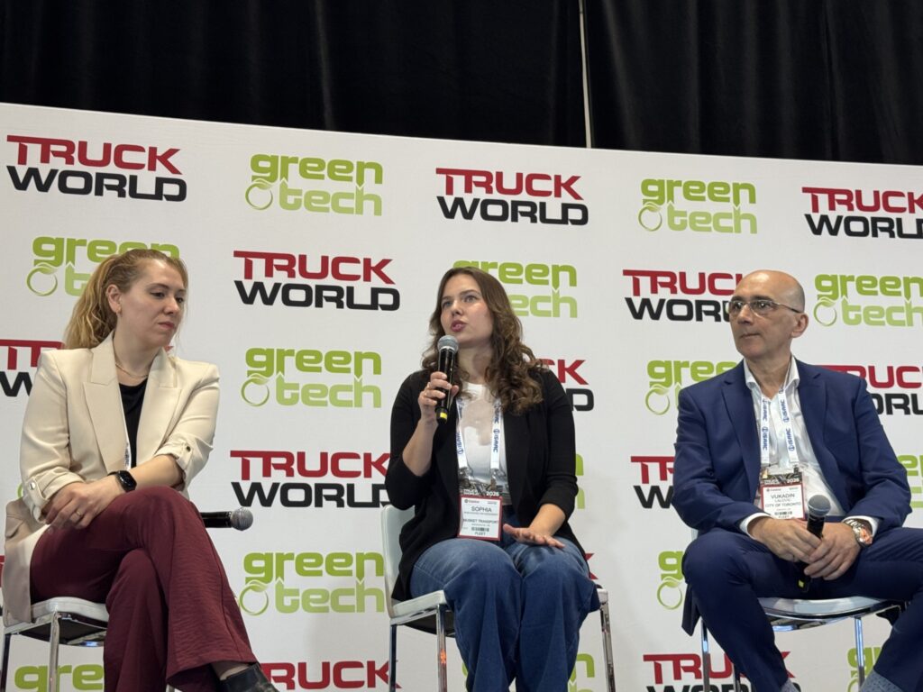 three panelists on stage