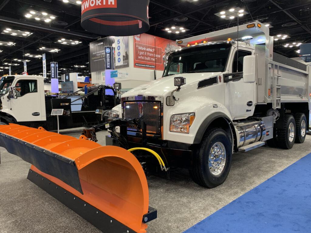 A Kenworth truck with a snowplow attachment