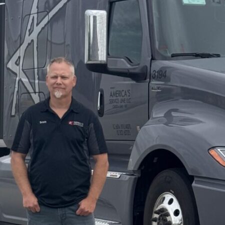 Scott Miller in front of his truck