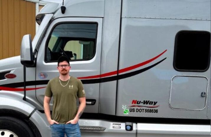 Driver Wade Dickinson in front of his truck