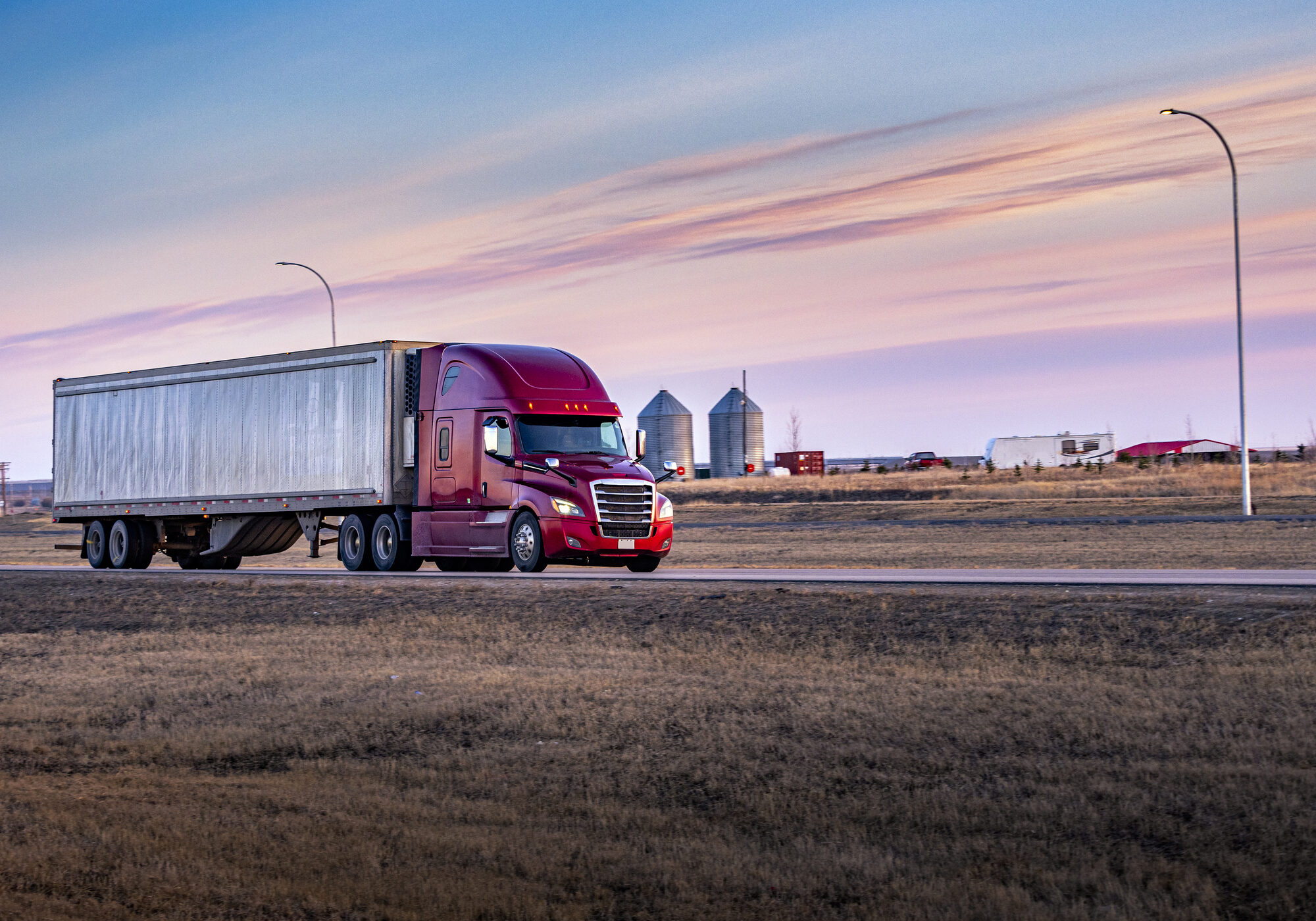 Semi Truck On the Rural Trans-Canada Highway at sunset.
