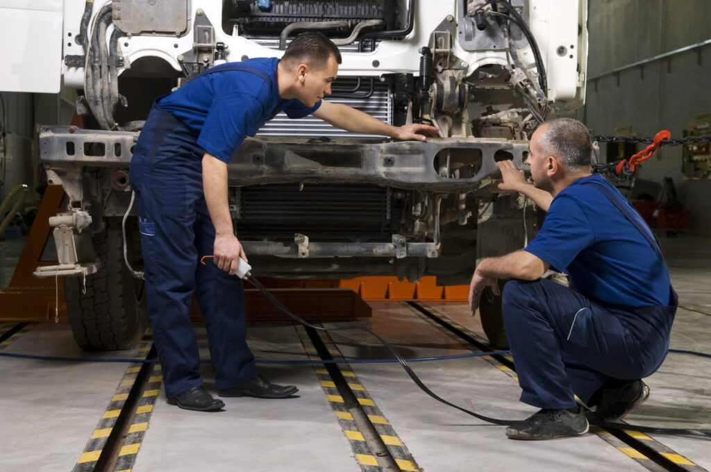 Technicians works on a truck.