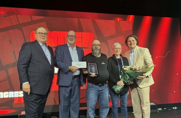 Michel Francoeur and his wife, Gayle Cooke, are joined by Marc Cadieux, president and CEO of the Association du camionnage du Québec, Alain Delisle of Volvo Trucks Canada, and David Morneau, chair of the ACQ board.