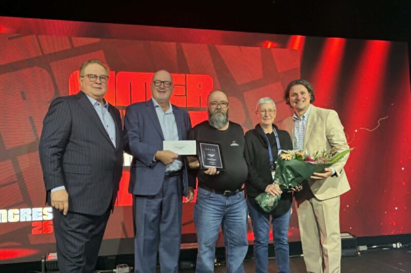 Michel Francoeur and his wife, Gayle Cooke, are joined by Marc Cadieux, president and CEO of the Association du camionnage du Québec, Alain Delisle of Volvo Trucks Canada, and David Morneau, chair of the ACQ board.