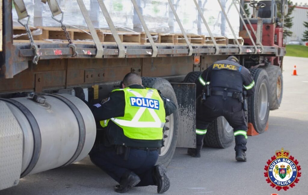 Police officers inspecting a commercial motor vehicle